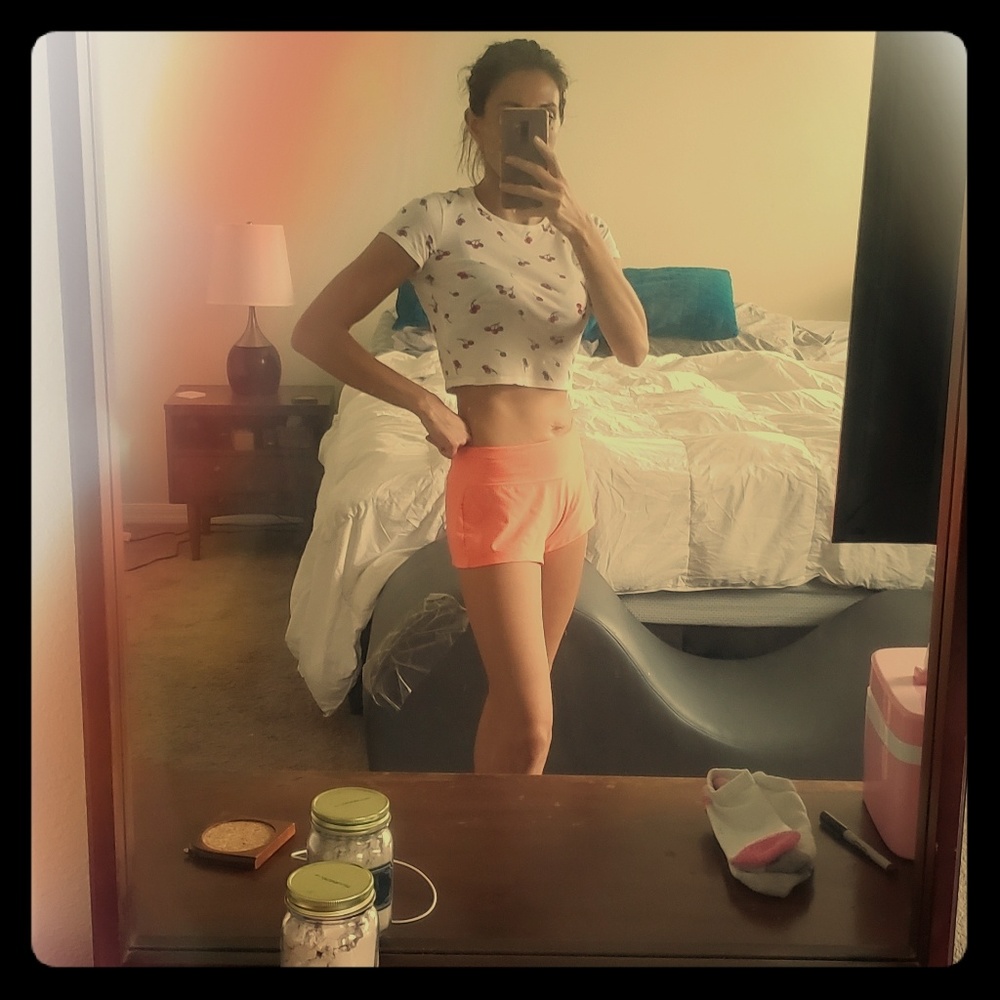 cherry print crop top and orange fitness shorts